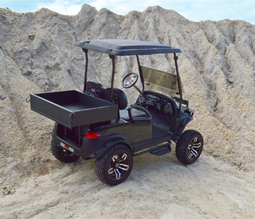 Black All Terrain Utility Golf Cart with Monsoon Roof driving in dirt at Key Largo Golf Carts