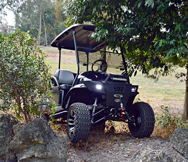 Black Utility Golf Cart with Lifted Suspension and All Terrain Tires at Key Largo Golf Carts